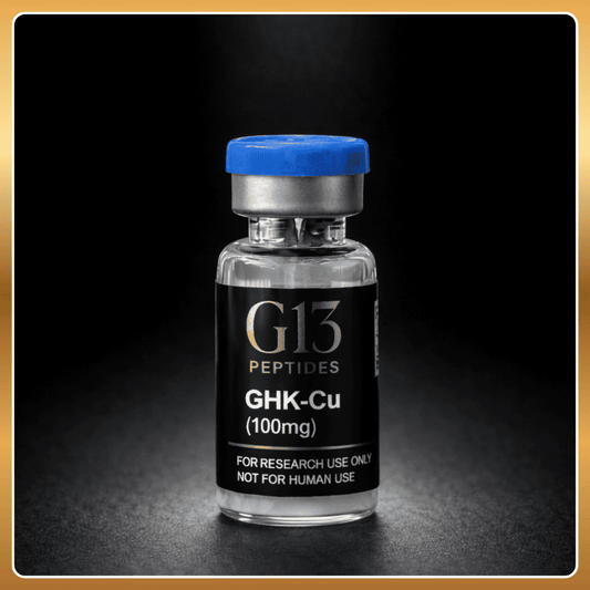Vial labeled 'G13 Peptides GHK-Cu (100mg)' on a dark background